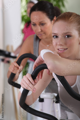 Woman using gym equipment