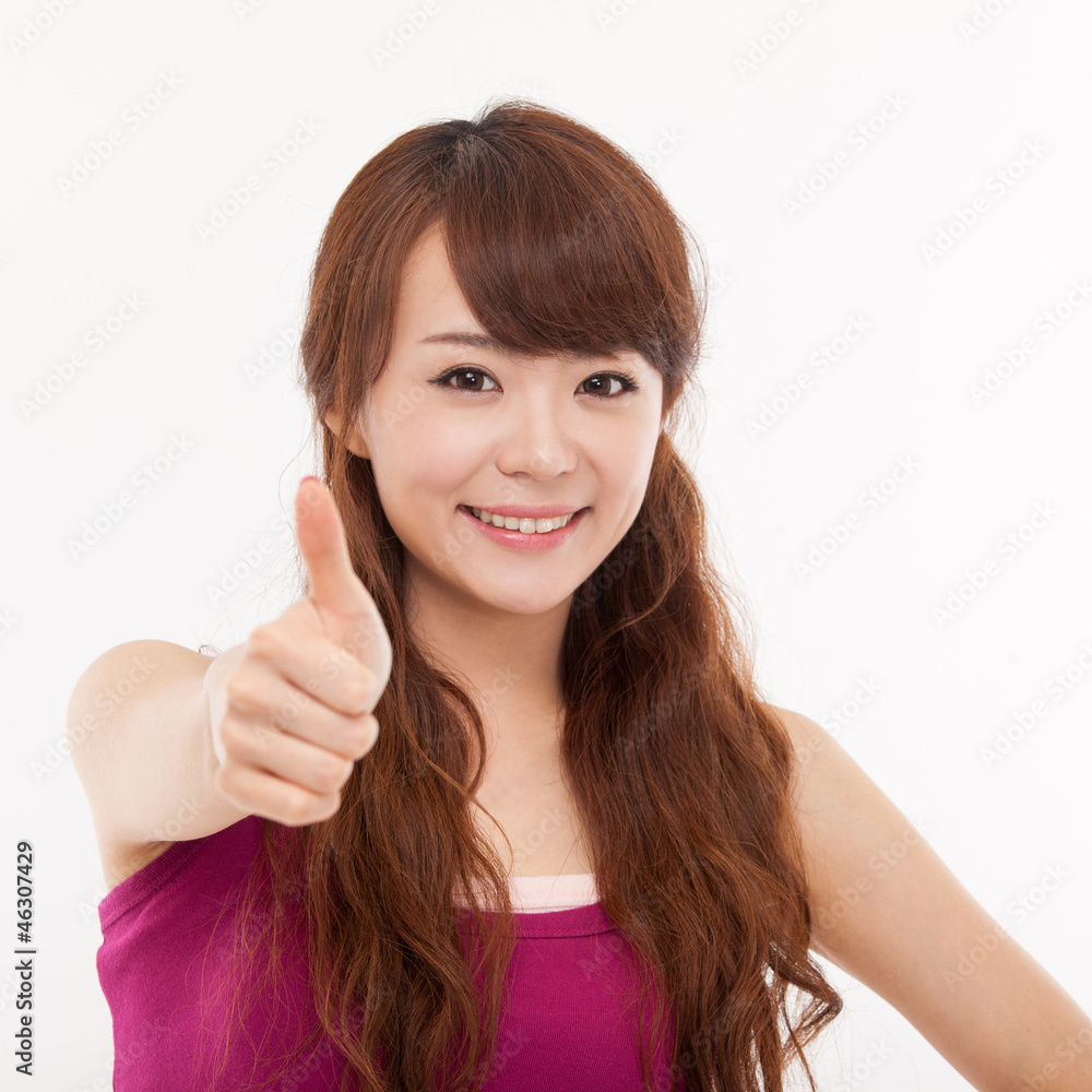 Young pretty Asian woman showing thumb. Young pretty Asian woman showing thumb.