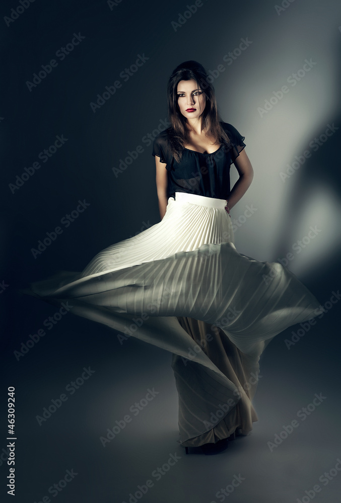 Fototapeta premium attractive woman in flying white skirt