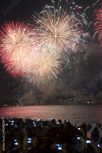 Fireworks display over sea