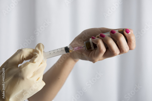 Beautiful women holding syringe