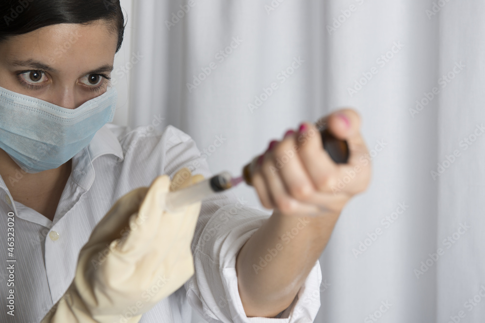 Beautiful women holding syringe Beautiful women holding syringe