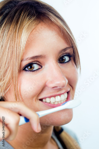 beautiful blonde woman picking his teeth 