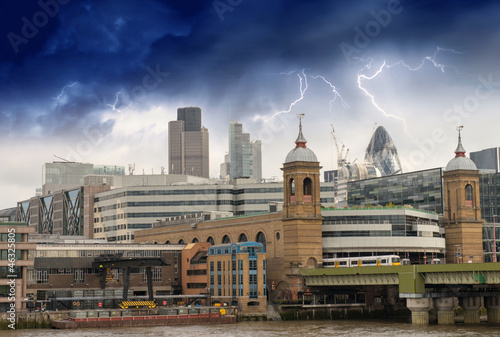 Storm over City of London, financial center and Canary Wharf at © jovannig