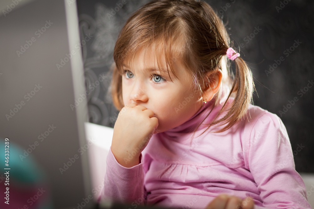 Girl looking at laptop screen Girl looking at laptop screen