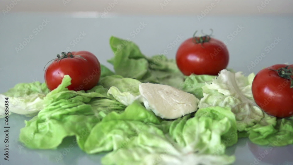 Mozzarella cheese falling on lettuce, slow motion shot at 480fps Mozzarella cheese falling on lettuce, slow motion shot at 480fps