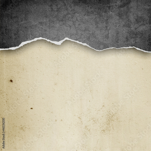 riped vintage paper on grunge background photo