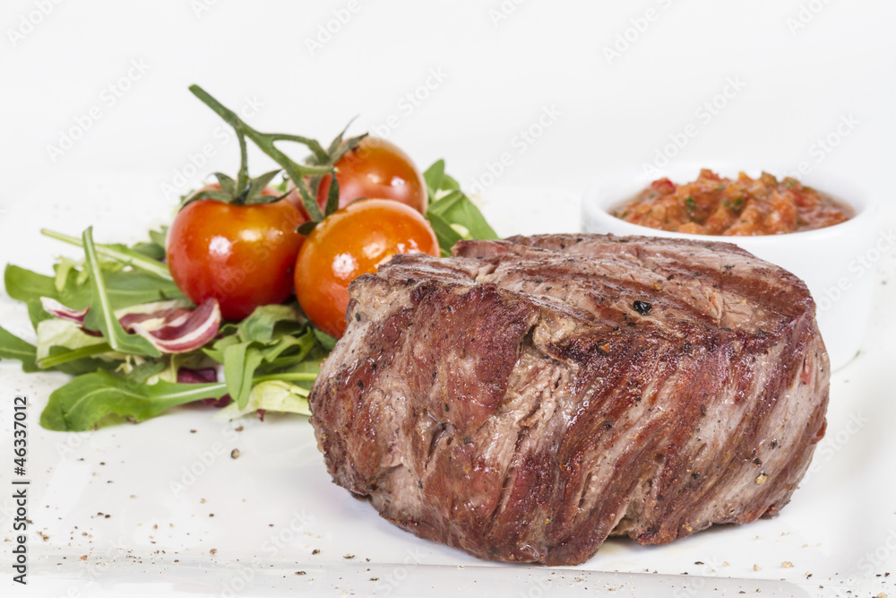 Grilled Beef Steak Isolated On a White Background Grilled Beef Steak Isolated On a White Background