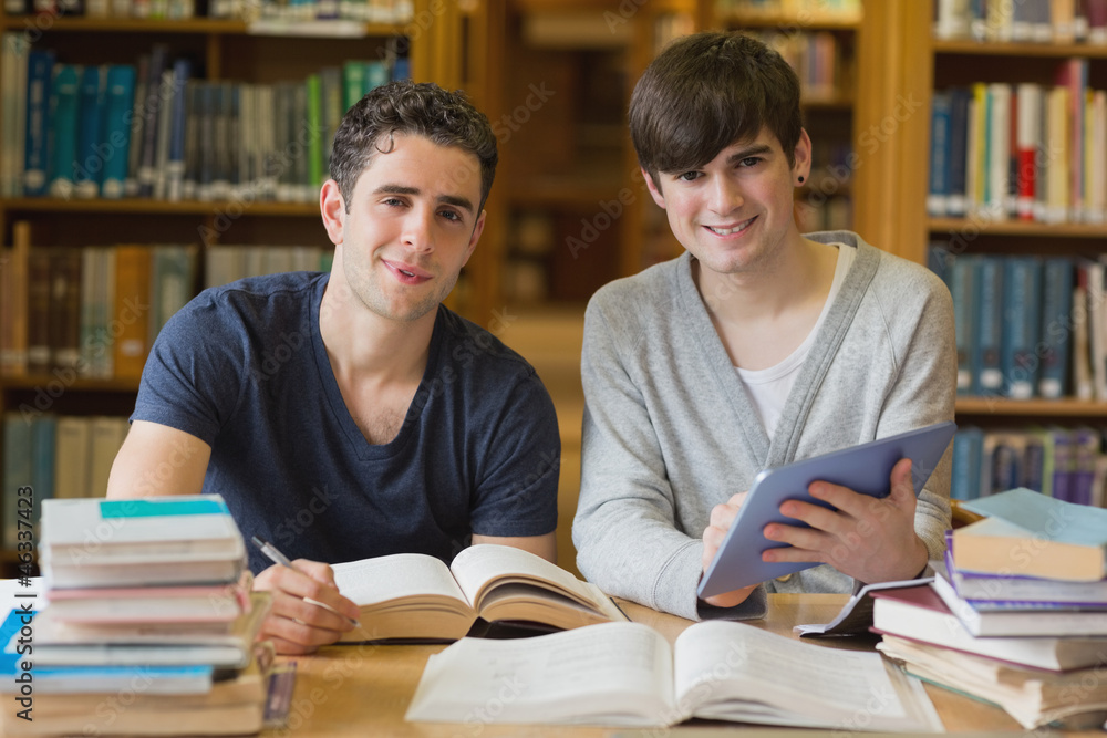 Young men looking up from studying Young men looking up from studying