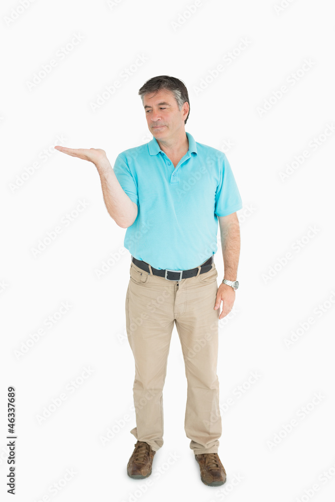 Man looking at his hand Man looking at his hand