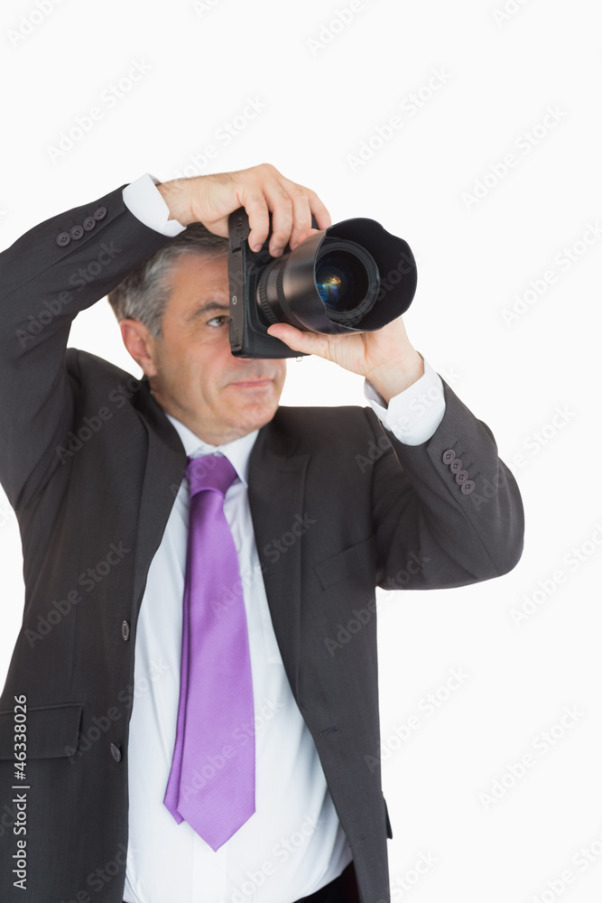 Man in suit taking picture Man in suit taking picture