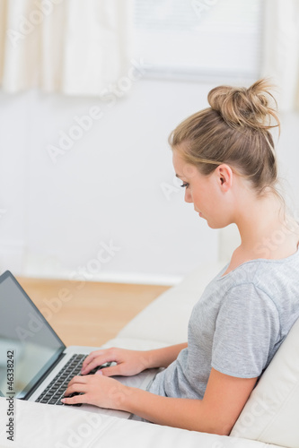 Blonde typing on the notebook