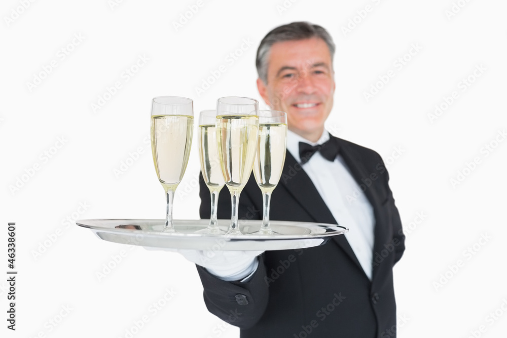 Waiter serving tray full of glasses with champagne Waiter serving tray full of glasses with champagne