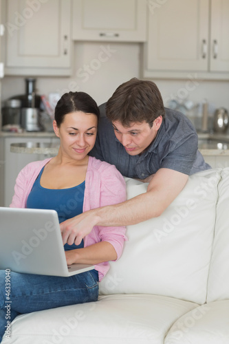 Young couple using the laptop