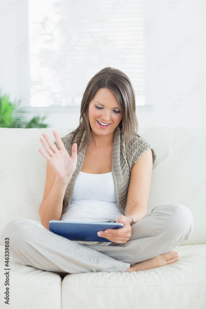 Woman using video chat on tablet pc Woman using video chat on tablet pc