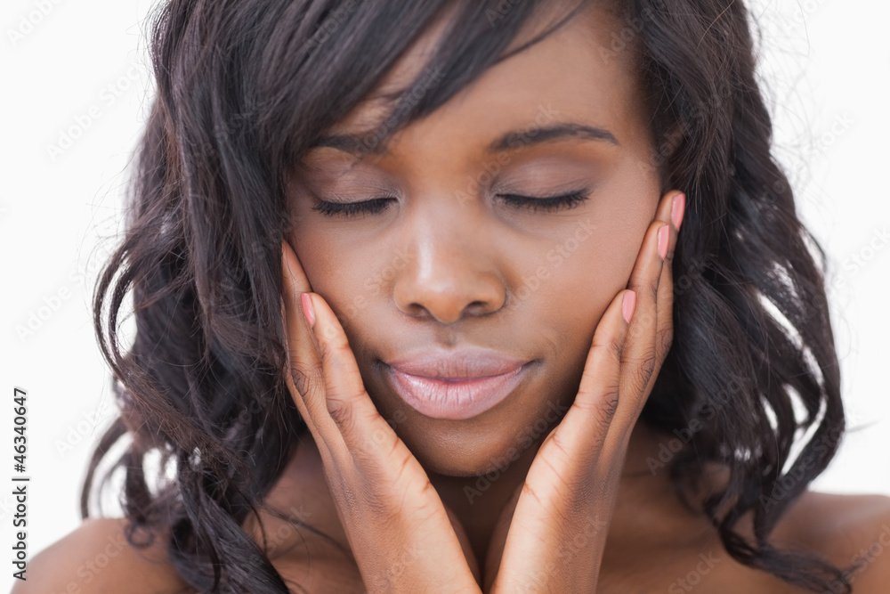 Woman hands in face while eyes closed Woman hands in face while eyes closed