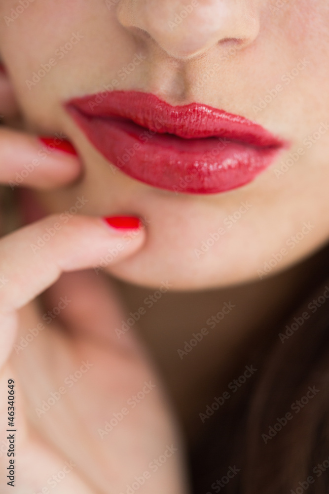 Fototapeta premium Close-up of woman showing her red lips