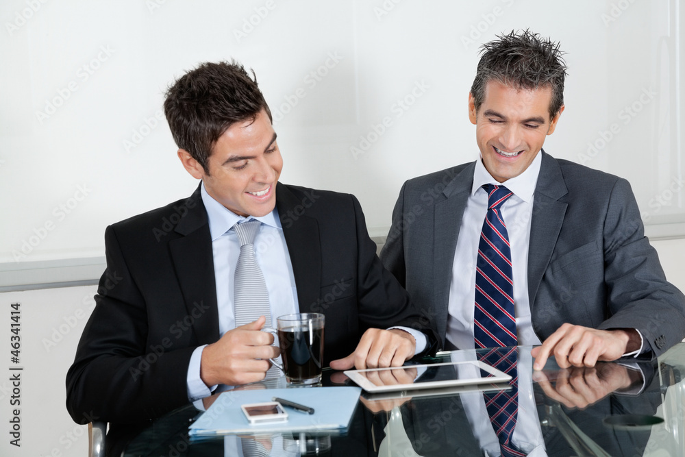 Fototapeta premium Businessmen Using Digital Tablet In Office