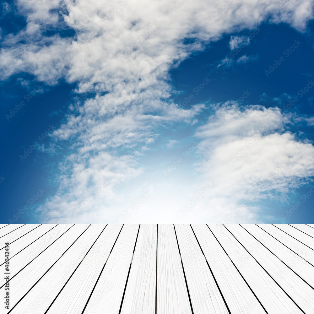 Texture of perspective white wood floor and cloudy sky