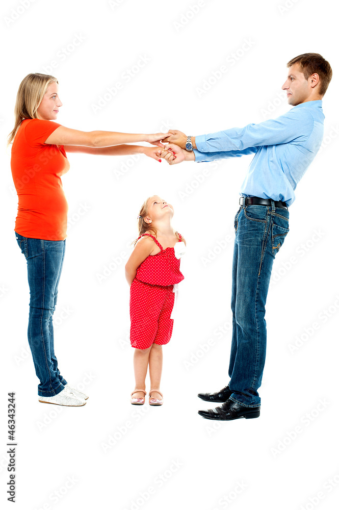 Playful family of father, mother and daughter Playful family of father, mother and daughter