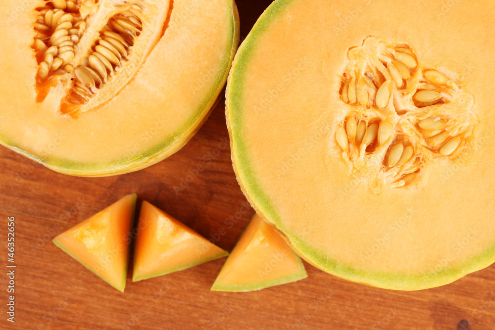 cut melon on wooden background close-up cut melon on wooden background close-up