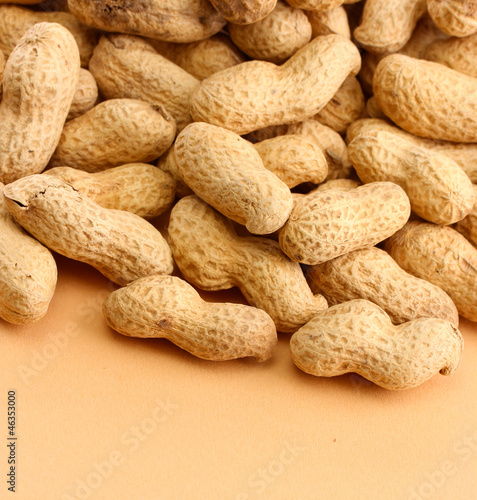 tasty peanuts, on beige background