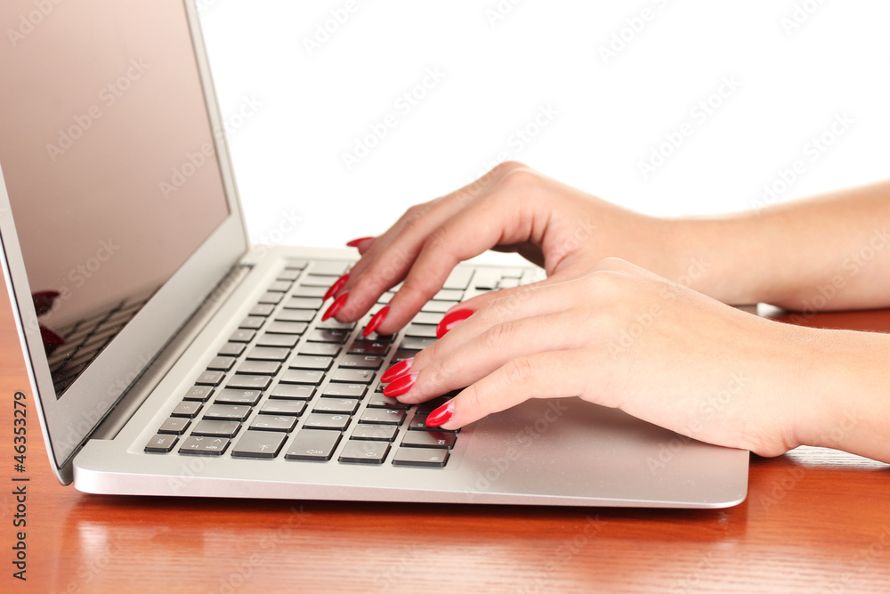 Detail of female hands using computer isolated on white Detail of female hands using computer isolated on white