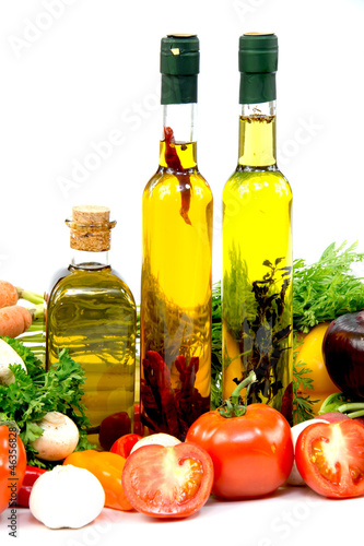 Fototapeta Naklejka Na Ścianę i Meble -  Olive oil, tomatoes, garlic, onion, cucumber and carrots