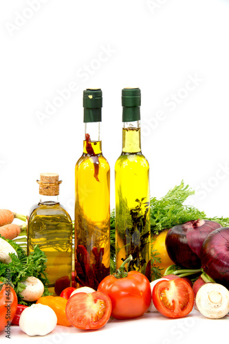 Fototapeta Naklejka Na Ścianę i Meble -  Olive oil, tomatoes, garlic, onion, cucumber and carrots