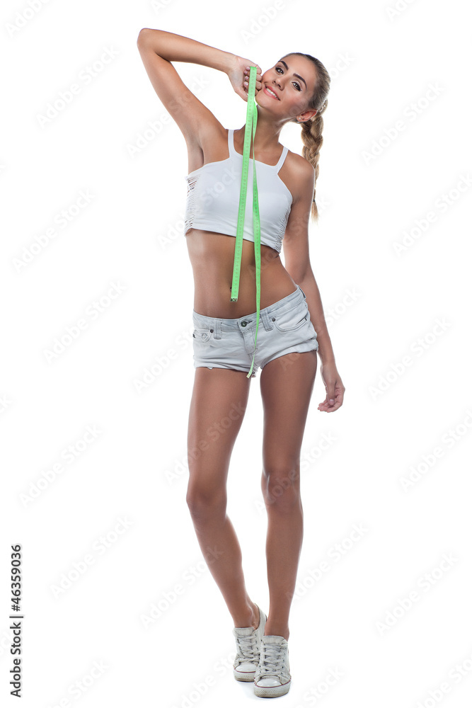 Woman in perfect shape with green measure doing yoga poses. C Woman in perfect shape with green measure doing yoga poses. C
