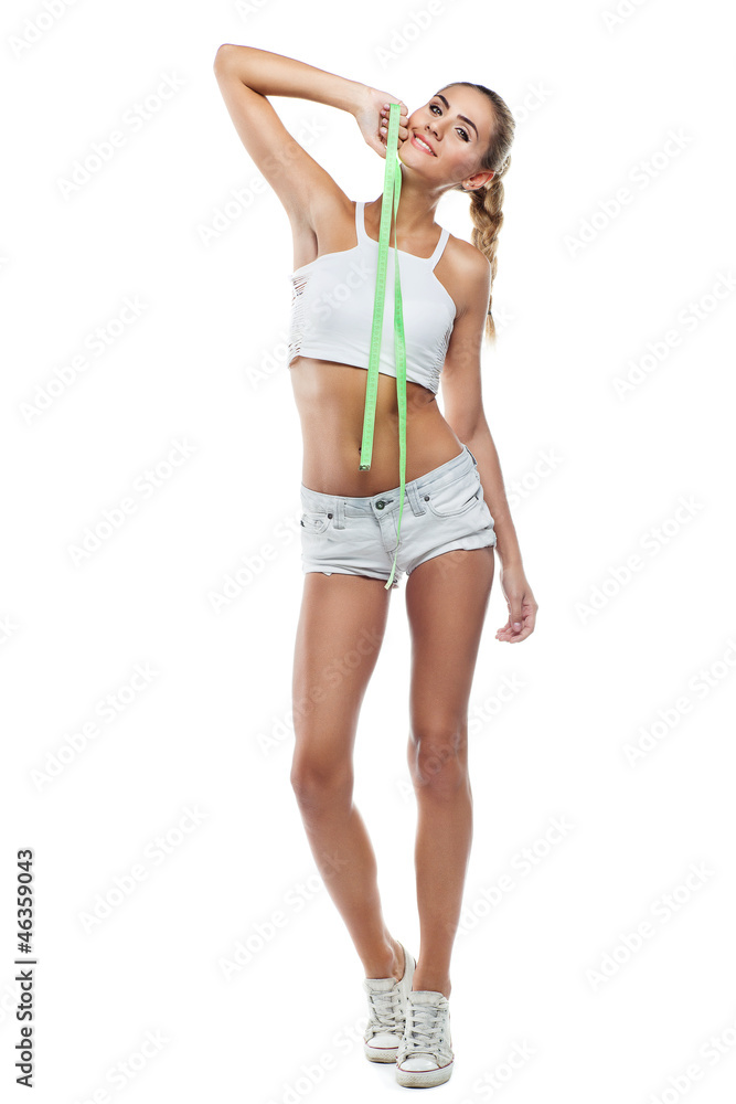 Woman in perfect shape with green measure doing yoga poses. C Woman in perfect shape with green measure doing yoga poses. C