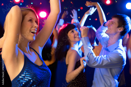 Beautiful girl dancing at a party