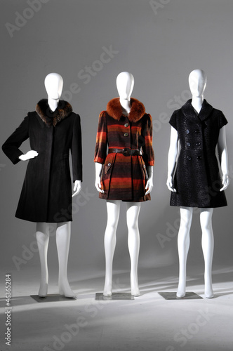 fashion female three, fur coat on a dummy isolated
