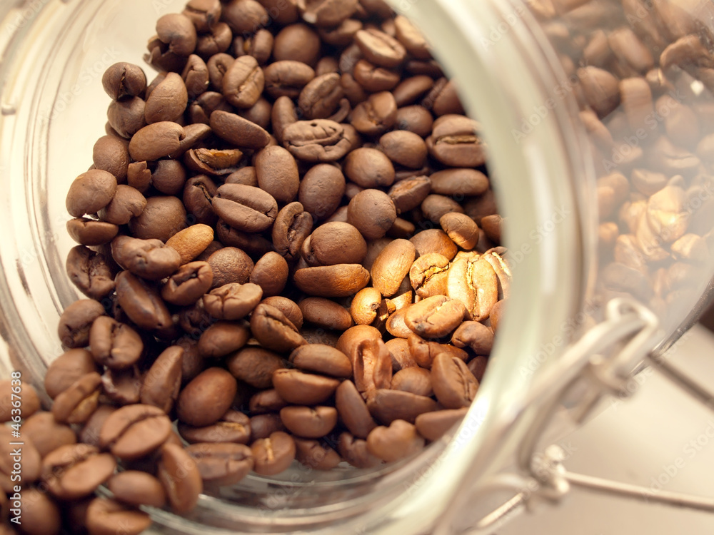 Heap of coffee beans from jar Heap of coffee beans from jar