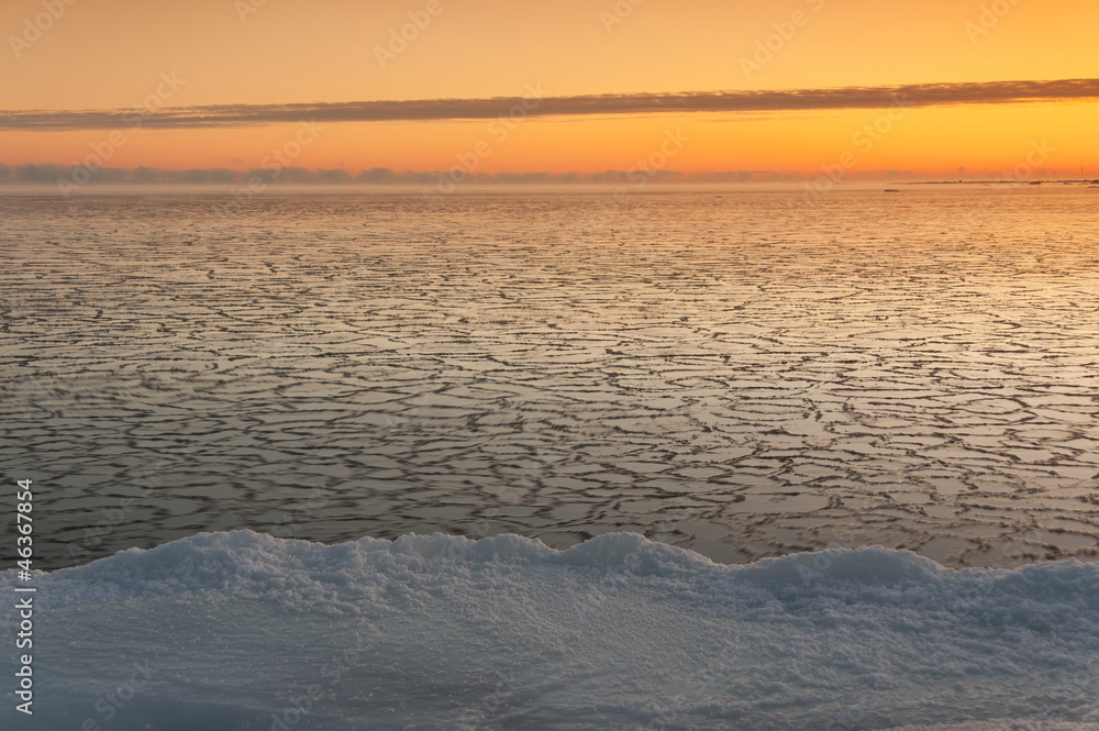 Icy sea at sunrise