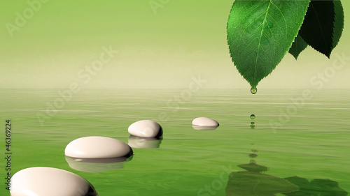 Zen stones in the blue water and green leaf with water drop
