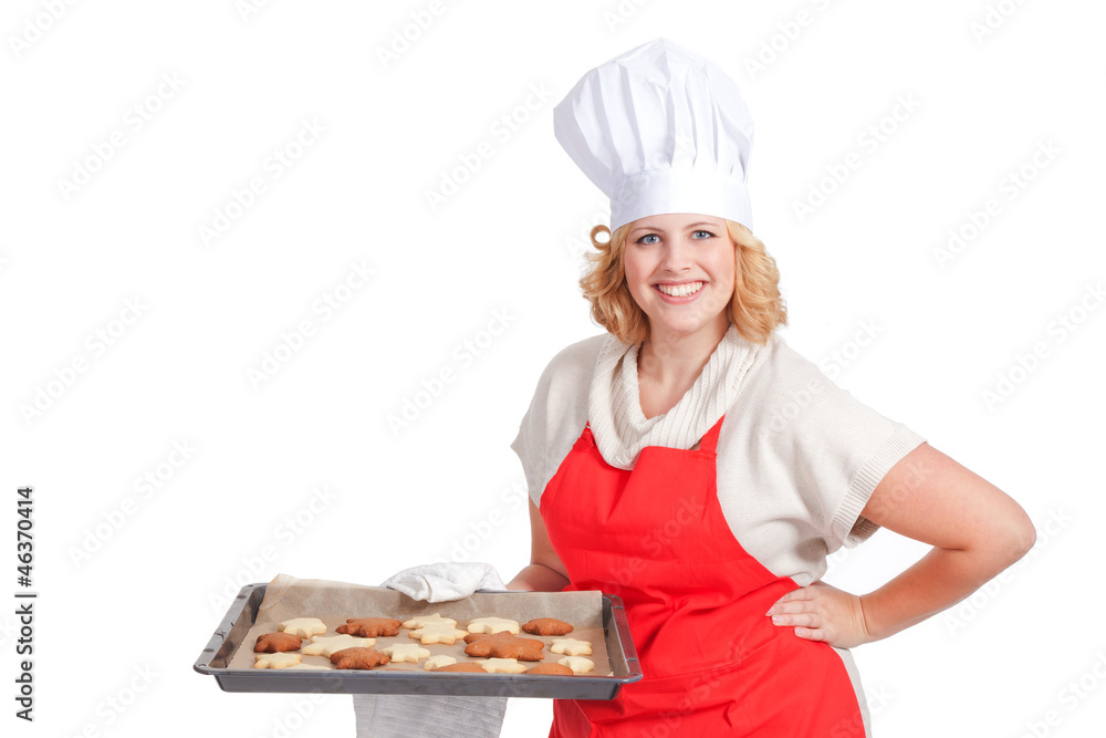 Frau mit Backblech und Weihnachtsplätzchen Frau mit Backblech und Weihnachtsplätzchen