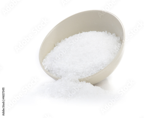Adding salt isolated on white background