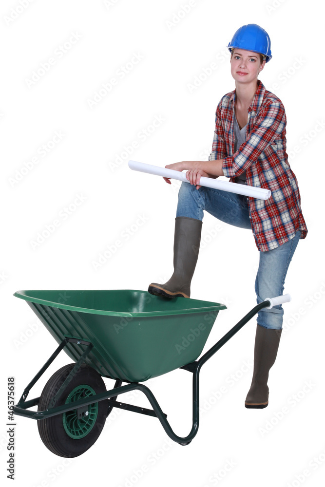 Female builder with wheelbarrow Female builder with wheelbarrow