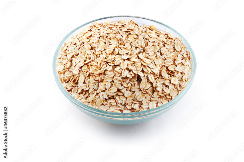 Oats in transparent bowl isolated on white Oats in transparent bowl isolated on white
