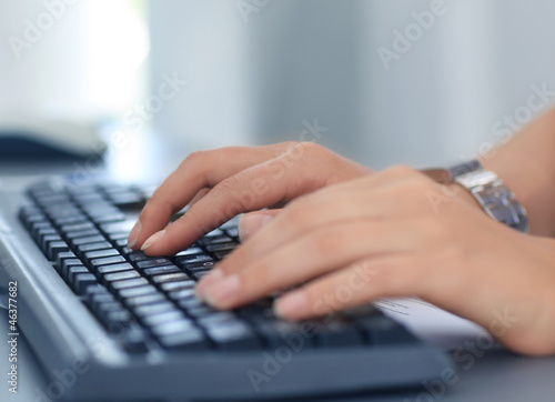 Close-up of typing female hands