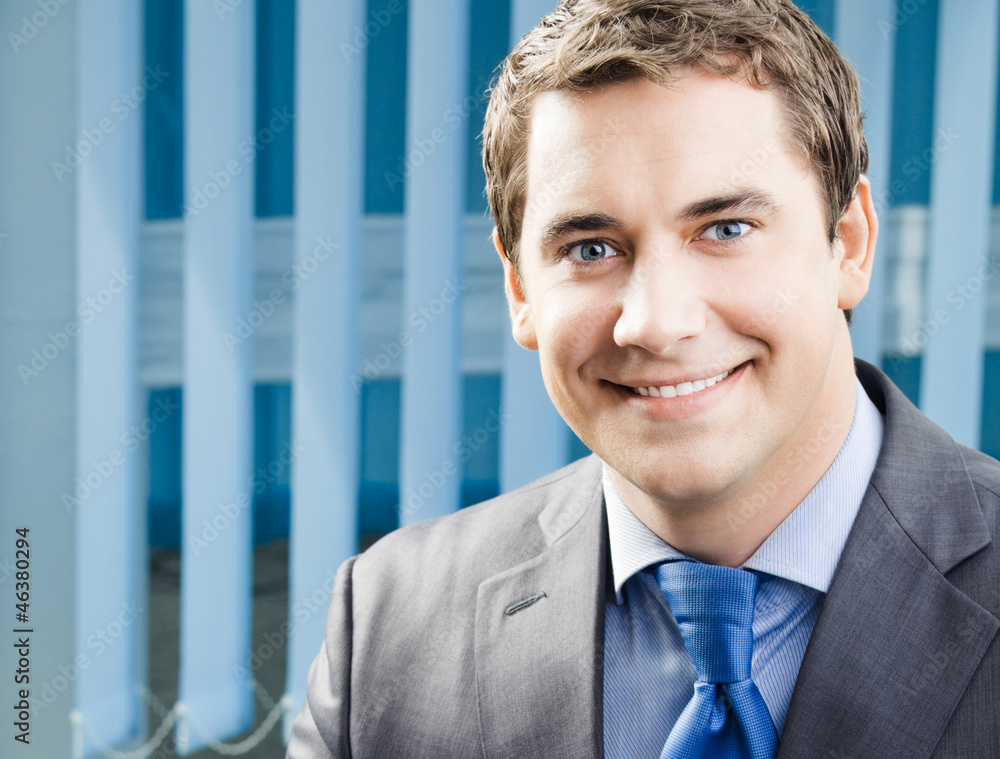 Portrait of smiling businessman at office Portrait of smiling businessman at office