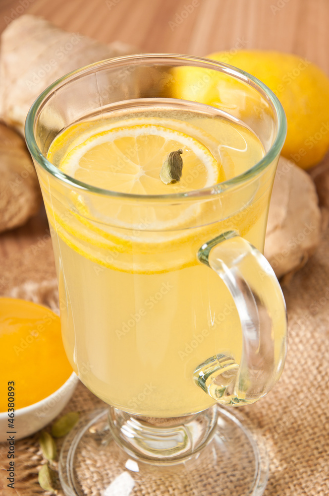 Healthy ginger tea with lemon and honey on the table Healthy ginger tea with lemon and honey on the table