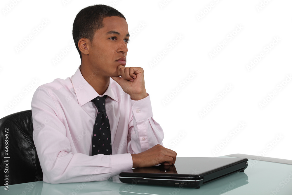 Distracted businessman sat at his desk Distracted businessman sat at his desk