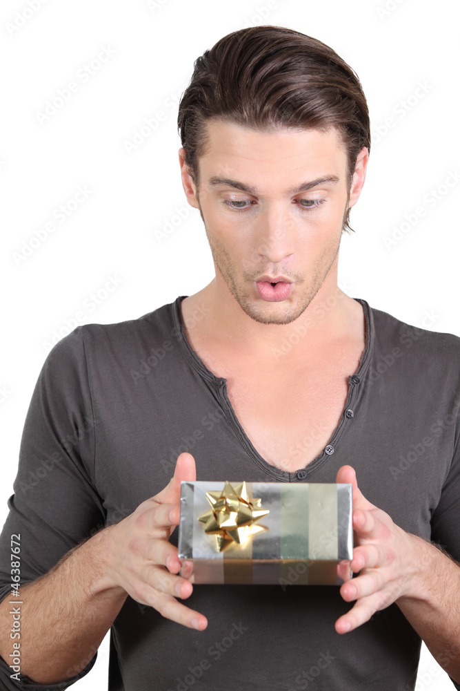 Man holding surprise gift