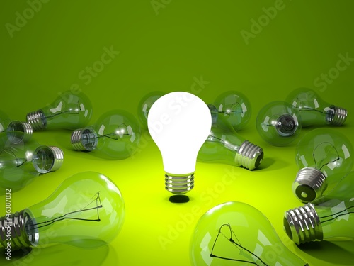 Light bulb on green background