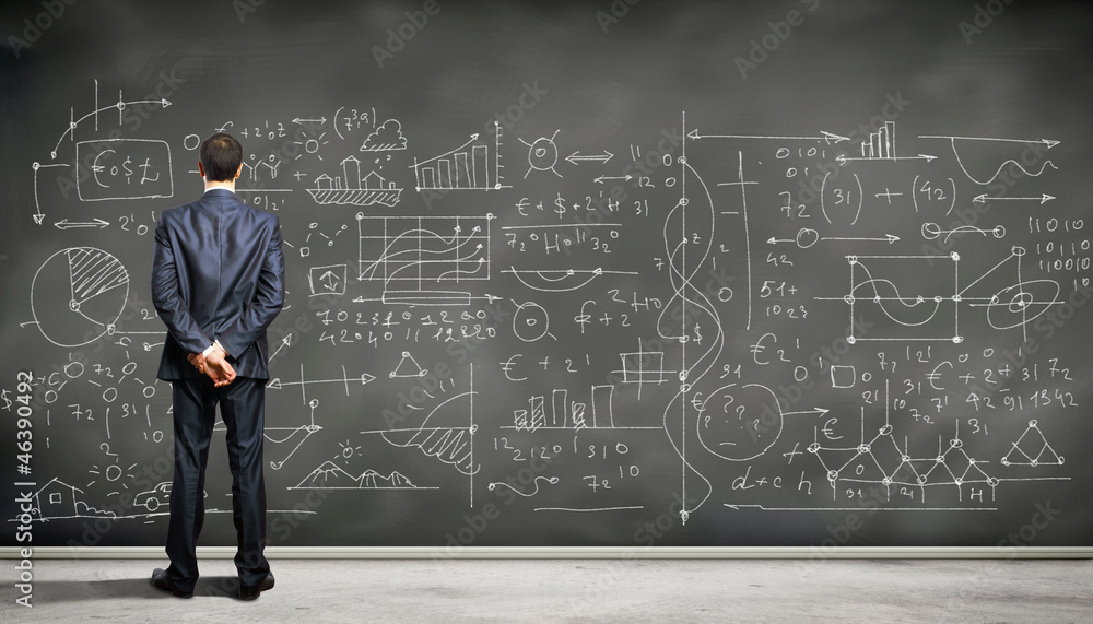 Business person against the blackboard Business person against the blackboard