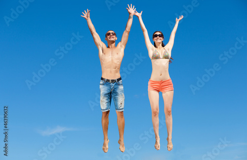 Happy Young Couple Together On The Beach