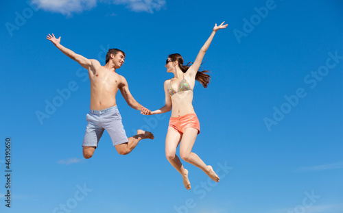 Happy Young Couple Together On The Beach