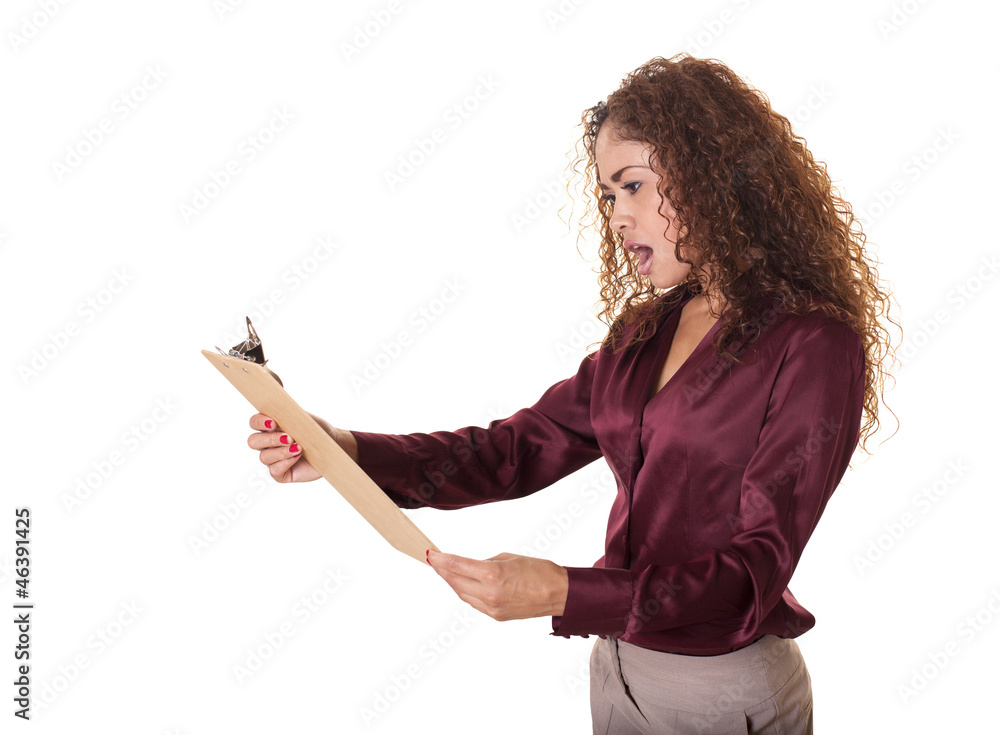 Woman is shocked by whats on her clip board. Woman is shocked by whats on her clip board.